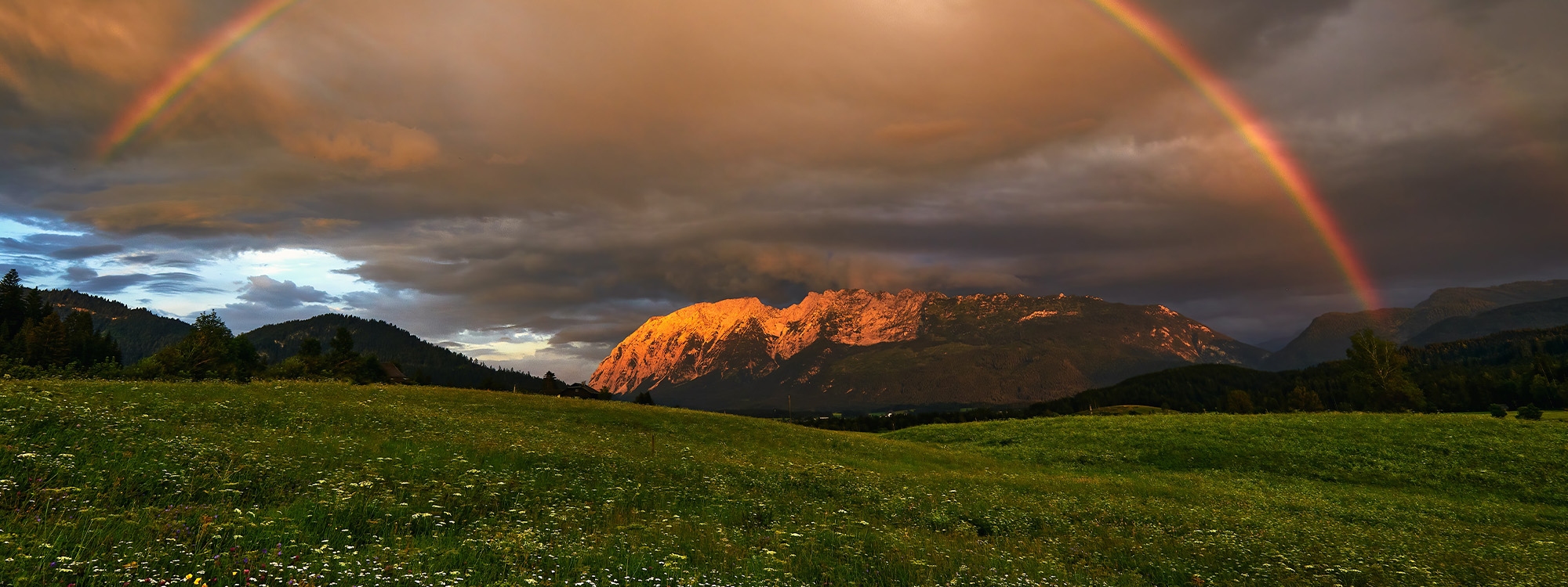 A beautiful rainbow over mountains and plains